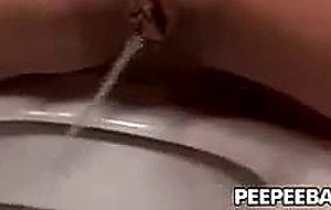Blond gal pissing and dildoing