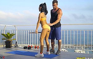 Apolonia lapiedra and her private trainer are working out on the rooftop