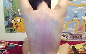 Caning her back spanking tits