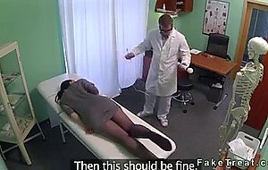 Brunette rubs pussy with massage tool at her doctor