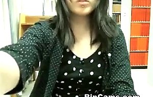 Asian undressing in library