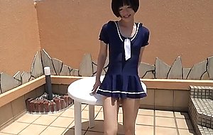 Sitting crossdresser in one piece skirt