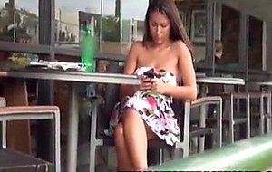 Surprise cumshot on chick sitting at cafe