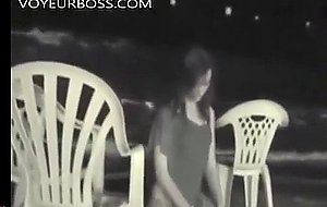 They catch a voyeur filming them having sex on the beach and taking her cherry