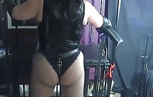 Gloved mistress pegging and smoking