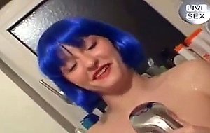 Bluehaired German girl in the bathroom