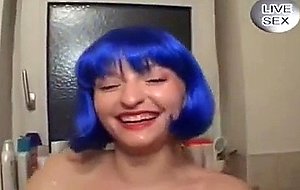 Bluehaired German girl in the bathroom