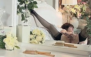 Solo masturbation featuring milf in stockings