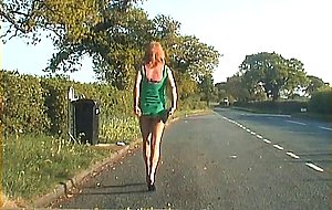 Mature shemale walking on a road