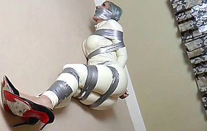 Horny blonde babe tied in tape in bondage fun
