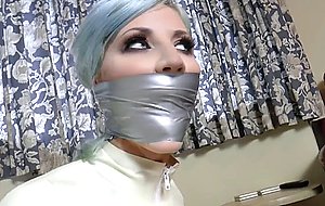 Horny blonde babe tied in tape in bondage fun