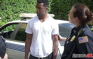 Hot milf dressed as police officers decide to arrest a black dude just to suck his black big cock