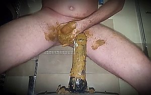 Gay man riding shit covered didlo