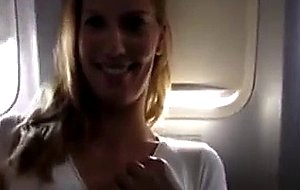 Masturbating her pussy in the airplane - free porn