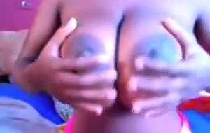 Sexy ebony with massive boobs teasing