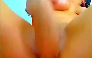 Squirting babe fisting and toying her pussy