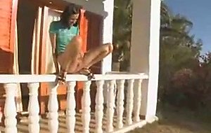 Russian brunette peeing off the porch