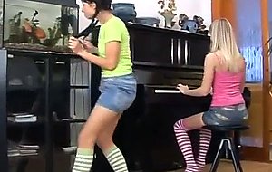 Sexy lesbians toy muffs on piano