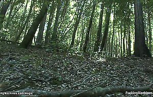 Two babes fucking machine in woods