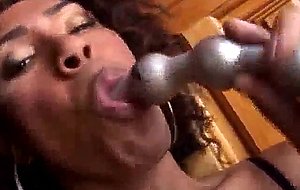 Ebony tranny plays with her tool and anal balls