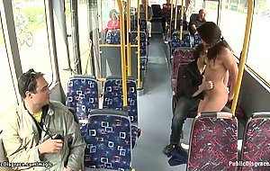 Gagged brunette fucked in public bus