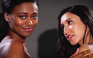 Black teen Jahla and amazing petite lesbian model Deisy Leon posed together