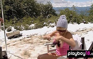 Hot blondies in sexy lingeries showing their big boobs on a snowy mountain