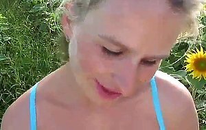 Pregnant blonde gets cum on her belly in a field
