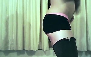 Crossdresser with toy poses in lingerie