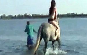 Cute girl rides horse in the nature