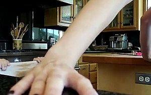 I get my friend’s sweet girlfriend on tape banging her wet pussy in the kitchen