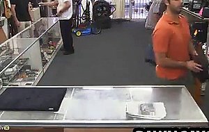 Horny hunk tugging on his cock at the pawn shop